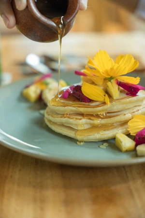 Pancakes served with fresh fruit